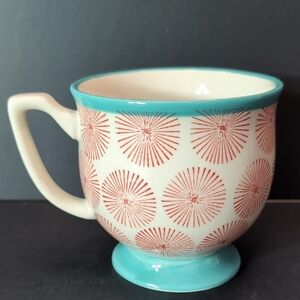 The Pioneer Woman Turquoise/Red Starburst Footed Happiness Mug.